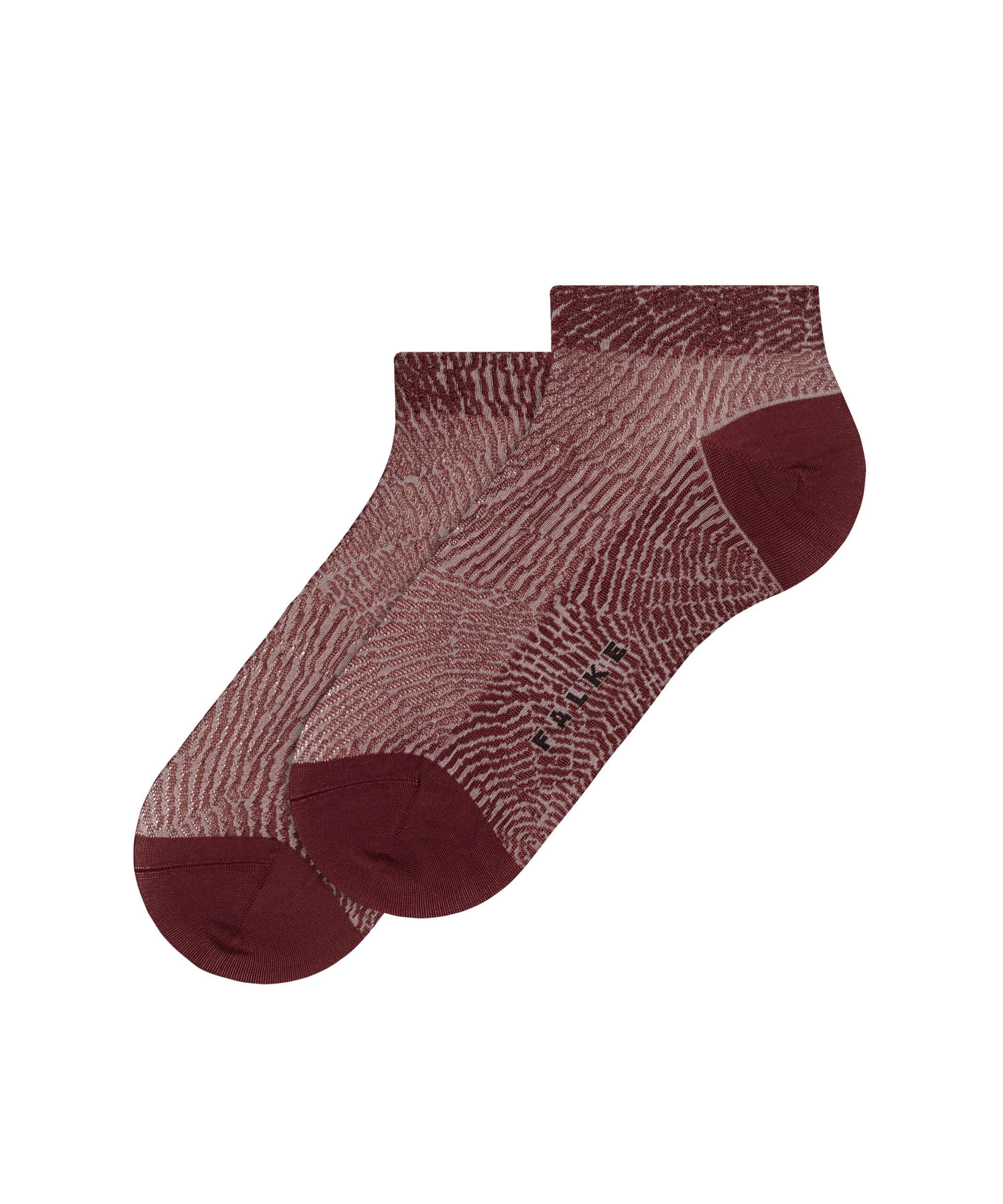 Die FALKE Legwear SS26 setzt mit diesen roten Socken und ihrem subtilen, dynamischen Wellenmuster ein stilvolles Statement.